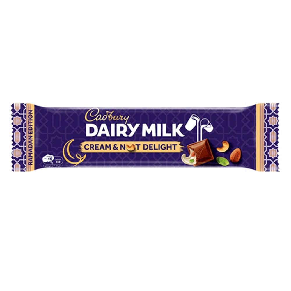 Cadbury Dairy Milk Cream & Nut Delight chocolate bar, 38g, featuring a rich purple wrapper with gold accents and Ramadan Edition design, showcasing nuts and chocolate imagery.