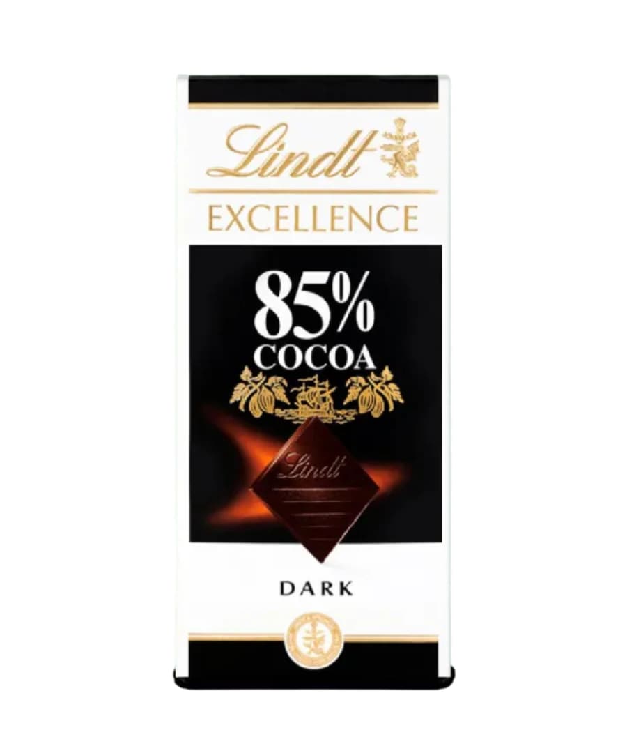 Lindt Excellence 85% Cocoa Dark Chocolate bar, 100g packaging featuring a sleek black and white design with gold accents. The front displays the cocoa percentage prominently, ideal for dark chocolate lovers.