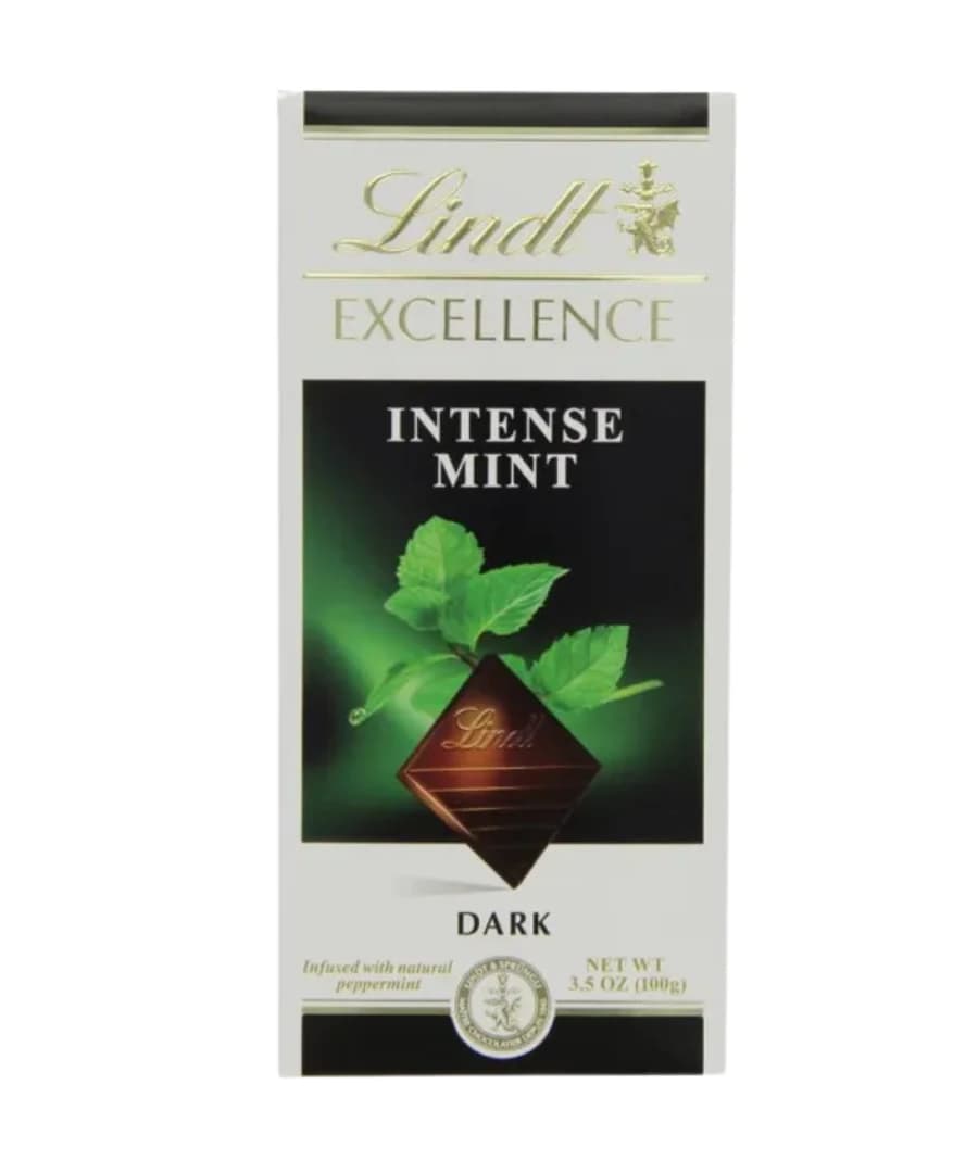 Lindt Excellence Intense Mint Dark Chocolate Bar, 100g. Elegant packaging featuring a dark green and white design with mint leaves, showcasing the premium quality of Lindt chocolate.